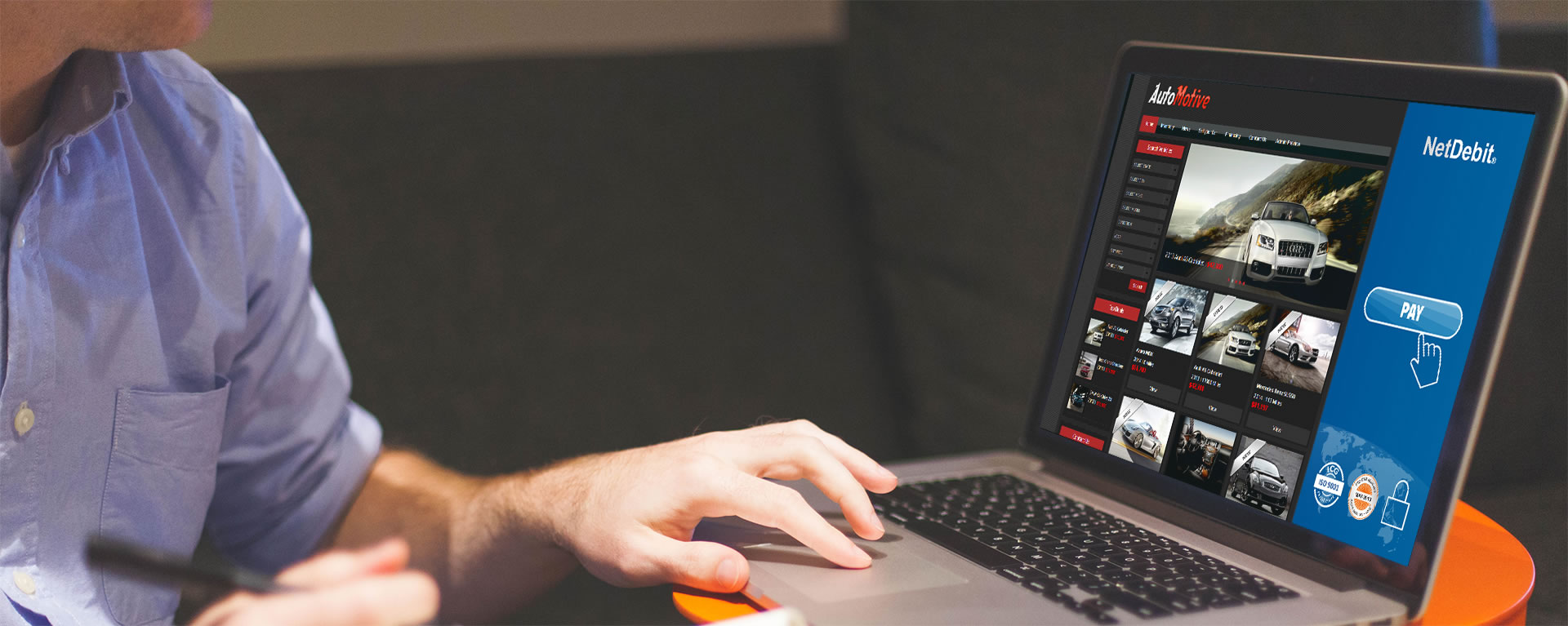 Man is sitting in front of a laptop - Screen shows website with banner ad